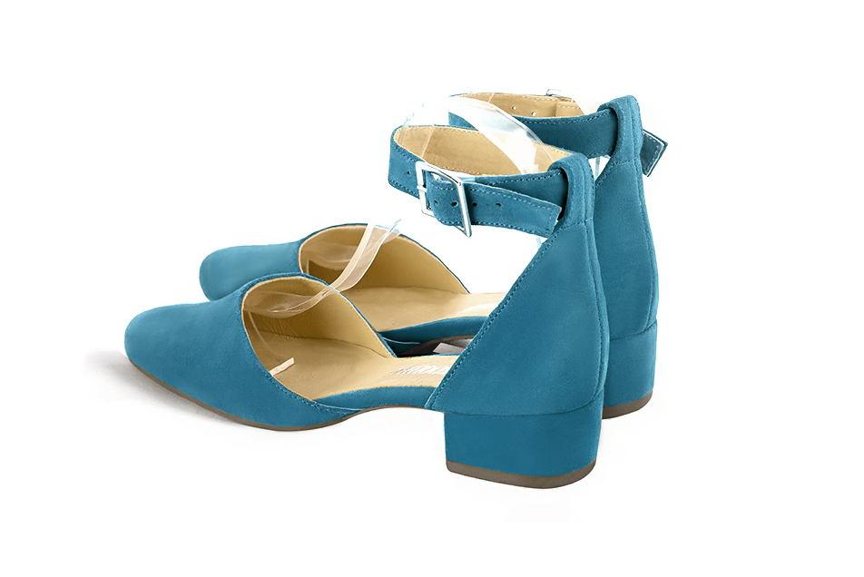 French elegance and refinement for these peacock blue dress open side shoes, with a strap around the ankle, 
                available in many subtle leather and colour combinations. Its high vamp and high bracelet will give you good support.
The flange will be adapted to the size of your ankle.
To personalize or not, according to your inspiration and your needs.  
                Matching clutches for parties, ceremonies and weddings.   
                You can customize these shoes to perfectly match your tastes or needs, and have a unique model.  
                Choice of leathers, colours, knots and heels. 
                Wide range of materials and shades carefully chosen.  
                Rich collection of flat, low, mid and high heels.  
                Small and large shoe sizes - Florence KOOIJMAN